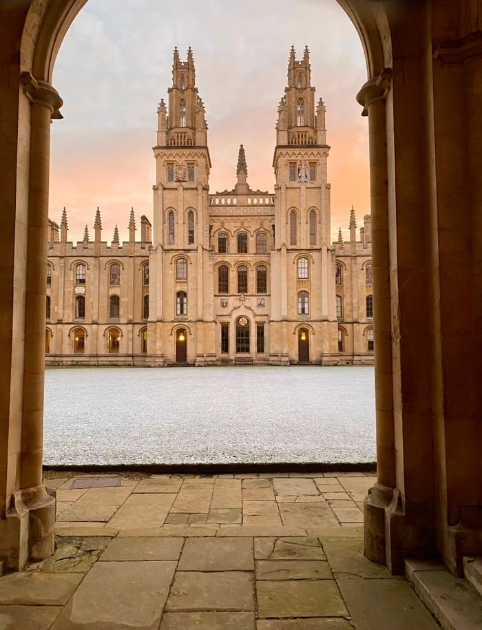 Elegant view of the All Souls College facade at Oxford, showcasing Gothic architecture.